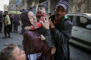 A Palestinian woman cries as she carries her wounded son following an Israeli airstrike in Bureij refugee camp, Gaza Strip, Thursday, Nov. 2, 2023.
by Mohammed Dahman
امرأة فلسطينية...