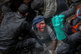 An injured Palestinian boy cries as rescuers try to pull him out of the rubble of a destroyed building following an Israeli airstrike in Bureij refugee camp, Gaza Strip, Thursday, Nov. 2, 2023.
by...
