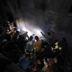 |Palestinians search among the rubble on the martyrs and the injured after the treachery planes targeting the security personnel in their house.

فلسطينيون يقومون بالبحث بين...