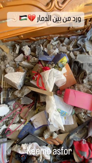 |Among all the rubble, a bouquet of roses embodies the love that was present at home among family members.

من بين كل الركام باقة ورد تجسد المحبة التي كانت...