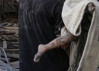 The dead body of a child in the rabbles of their bombardment home #gazaunderattack #gazawar #epaimages #palestine