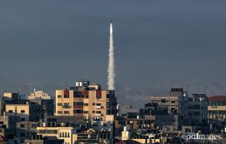 A rocket is launched from the coastal Gaza strip towards Israel by militants of the Ezz Al-Din Al Qassam militia, the military wing of Hamas movement, 07 October 2023. Rocket barrages were launched...