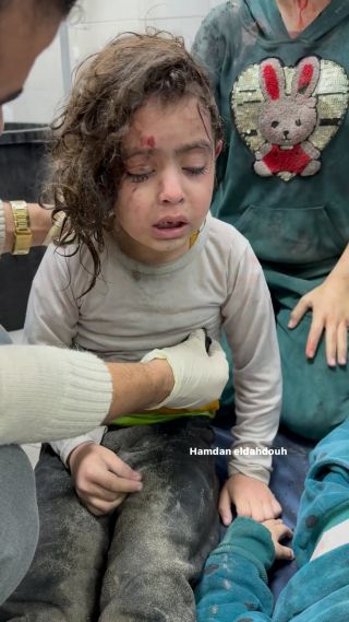 |A girl emerges from the rubble alive..
She cries and trembles from the horror of what she witnessed..

Crying on the martyrs who were killed in front of her eyes, from a house that crumbled above...
