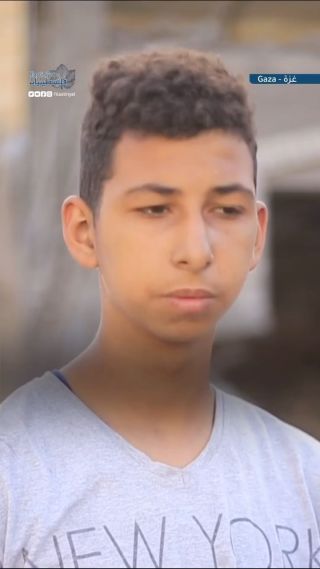 |Ahmad Salem likes to raise animals. He speaks from in front of his bombed house in the Nusseirat refugee camp.
احمد سالم، يحب تربية الحيوانات، يتحدث من أمام...