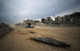 A car drives by an Israeli missile laying on the ground in the middle of a street next to destroyed houses following an Israeli #military #operation in #Gaza Strip 📸 EPA / Mohammed Saber ⁠...