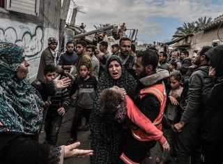 A Palestinian mother of the Al Rus family mourns the loss of her daughter, a victim of the Israeli attack that struck the home of the Abu Al-Rus family in Deir Al Balah, Gaza, on January 2, 2024. The...