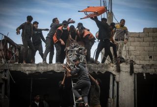 Palestinians evacuate a wounded man from a destroyed building following Israeli airstrikes in Khan Younis refugee camp, southern Gaza Strip, Thursday, Dec. 7, 2023.
by Mohammed...