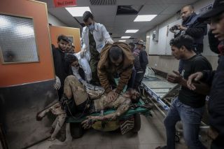 Image depicts graphic content) Injured Palestinians are brought to Al-Aqsa Martyrs Hospital with a horse car due to shortage of proper equipment as Israeli attacks continue in Deir al Balah, Gaza on...