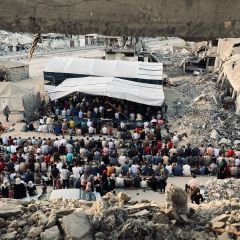 Citizens hold Eid al-Adha prayers among the rubble in the city of Khan Yunis after the Israeli occupation destroyed most of its mosques. The feelings of Gazans were mixed between happiness at...