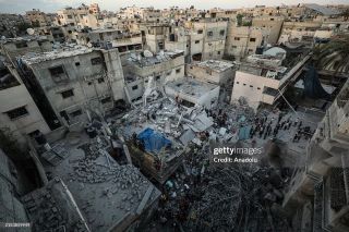 Israeli attacks on Gaza continue

GAZA CITY, GAZA - MAY 24: Civil defense teams and residents carry out search and rescue efforts after an Israeli attack hits the house belonging to the Al Nadi...
