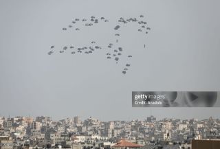 Dropping aid from planes into Gaza as Israeli attacks continue

GAZA CITY, GAZA - APRIL 23: Humanitarian aid packages are seen landing by the help of parachutes after dropping from a plane as Israeli...