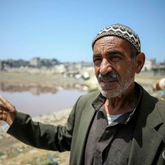 Ali, the grandfather, and Mahmoud, the father of Palestinian boy Zein Oroq, who was wounded after he was hit by aid airdropped on Gaza and later succumbed to his wounds, stand near their house which...