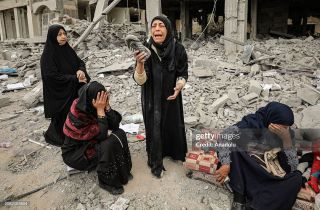 At least 80 Palestinians killed in overnight Israeli attacks against Gaza

GAZA CITY, GAZA - MARCH 16: Palestinians cry for their family member trapped under the rubble of collapsed buildings hit by...