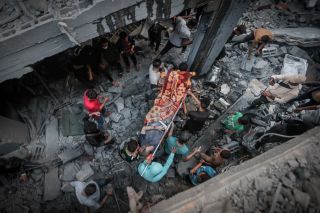 Palestinians evacuate an injured man that was found under the rubble of a destroyed house following an Israeli airstrike in Khan Younis refugee camp, southern Gaza Strip, Saturday, Nov. 18, 2023.
by...